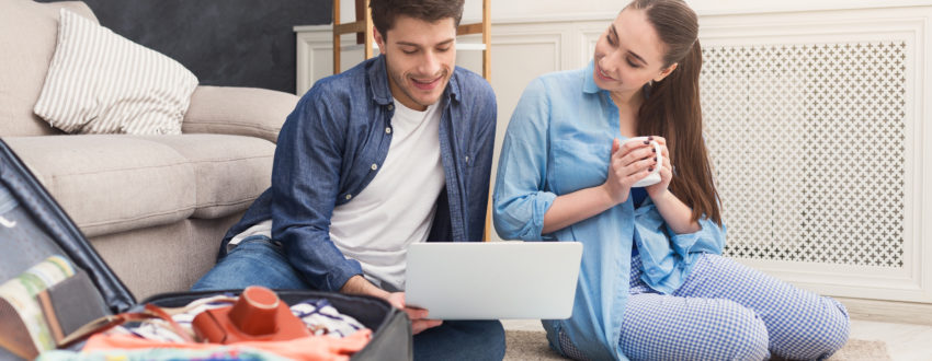 Couple Planning Trip, Studying Map At Home