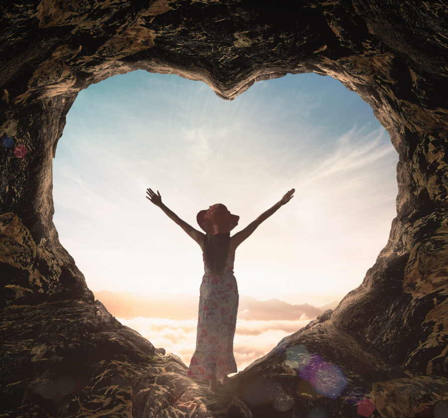 Alone Woman Standing On Cave Of Heart