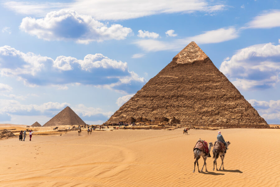 The Pyramids And Bedouins In The Desert Of Giza, Egypt