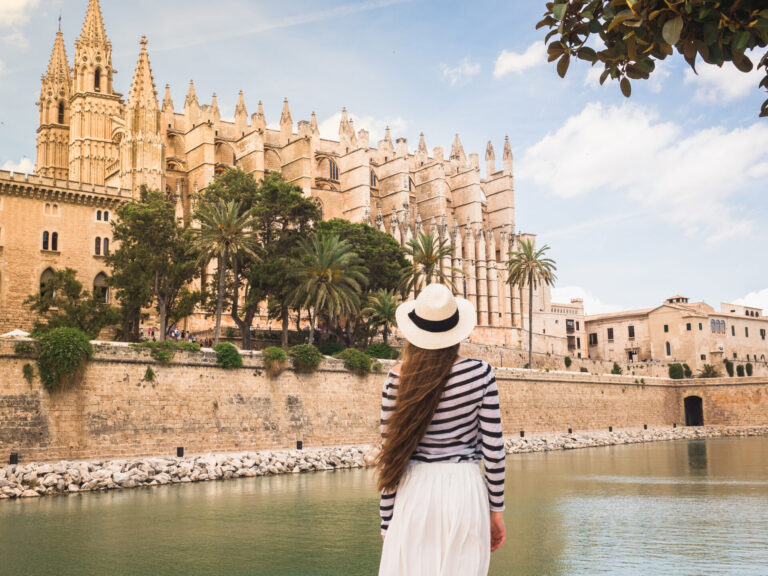 Stylish, Beautiful Woman On The Background Of Palm Trees
